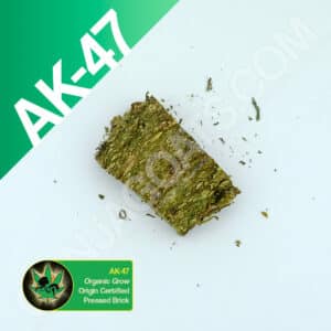 Close up photo of the pressed brick cannabis strain AK-47. Text next to the flower states the name of the strain, that it is organically grown, and pressed brick weed.