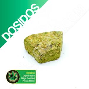 Close up photo of the pressed brick cannabis strain Dosidos. Text next to the flower states the name of the strain, that it is organically grown, and pressed brick weed.